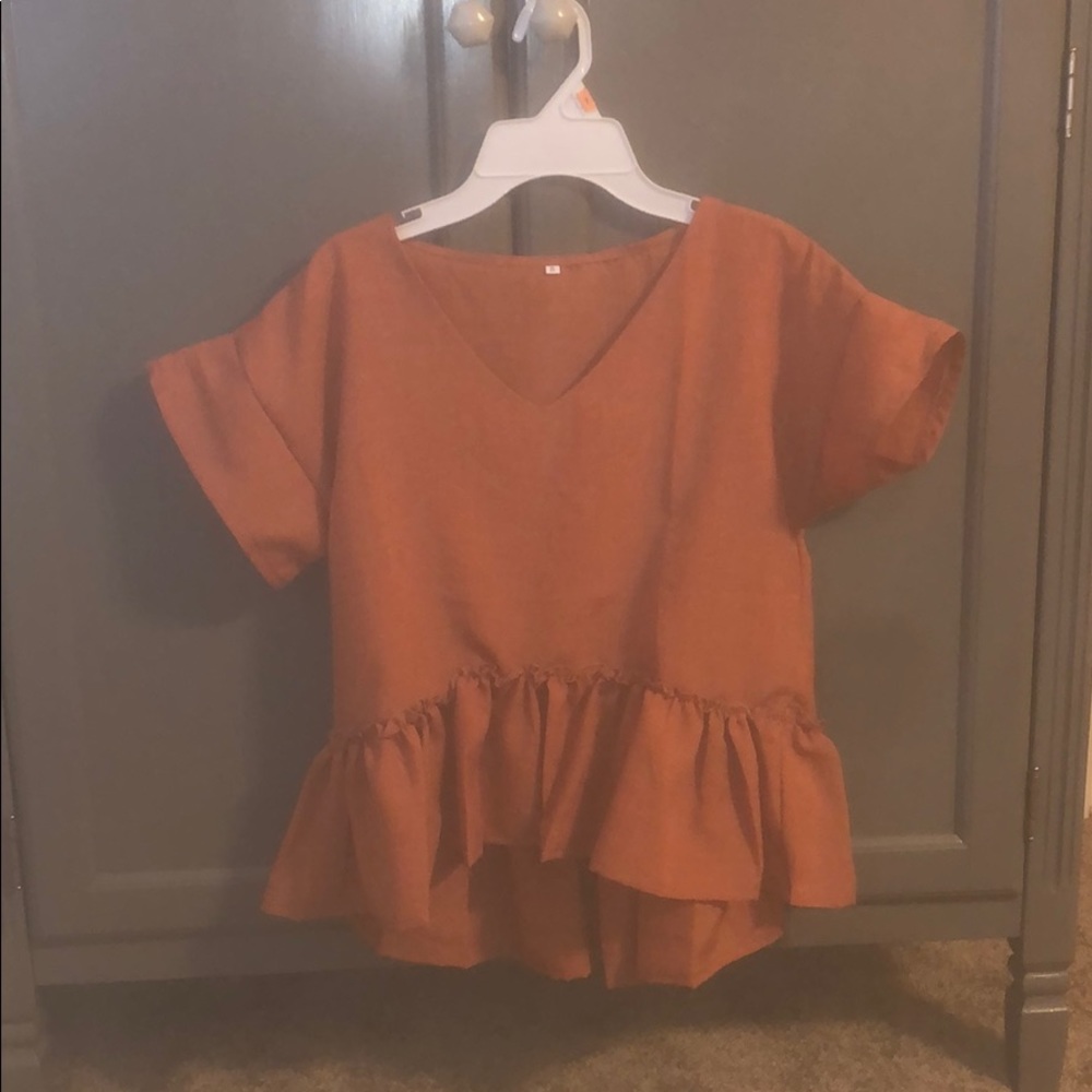 Super cute reddish-orange blouse